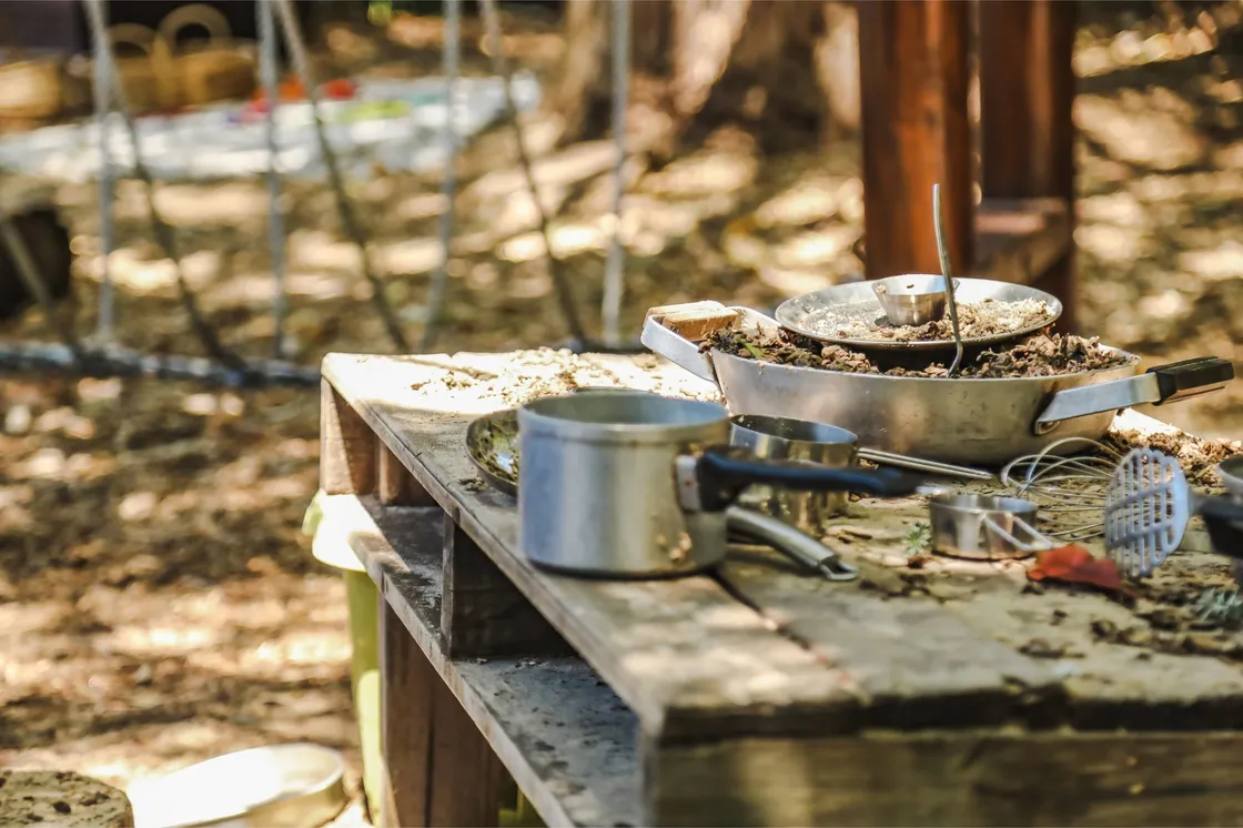 An outdoor mud kitchen play area at a child care program